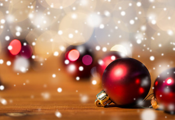 Image showing close up of red christmas balls on wood