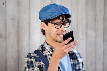 Image showing man recording voice or calling on smartphone