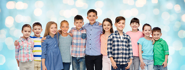 Image showing group of happy smiling children hugging