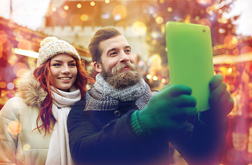 Image showing couple taking selfie with tablet pc in old town