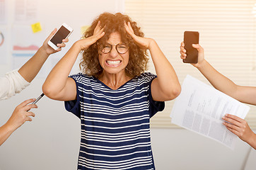 Image showing Busy woman at the office