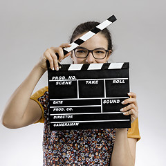 Image showing Woman with a clapboard