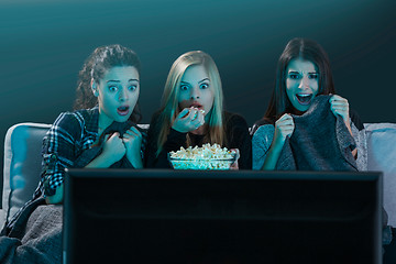 Image showing Scared teenage watching movies 