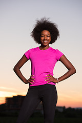 Image showing Portrait of a young african american woman running outdoors