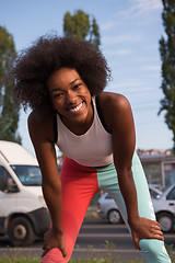 Image showing Portrait of sporty young african american woman running outdoors