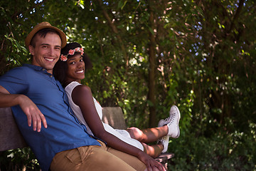 Image showing Young multiethnic couple having a bike ride in nature