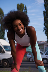 Image showing Portrait of sporty young african american woman running outdoors