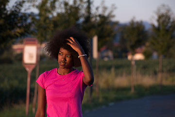 Image showing Portrait of a young african american woman running outdoors