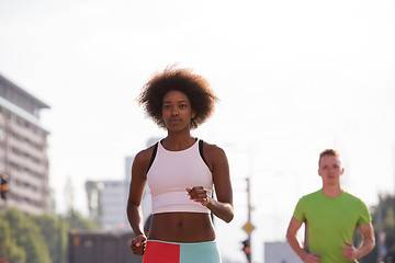 Image showing multiethnic group of people on the jogging