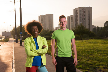 Image showing Portrait of romantic pretty couple on fitness session, outside t