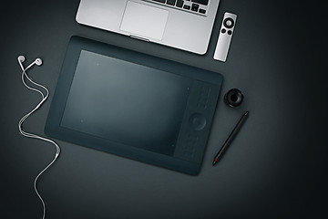 Image showing Workplace of business. Modern male accessories and laptop on black background