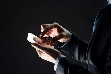 Image showing close up of businessman with glass smartphone