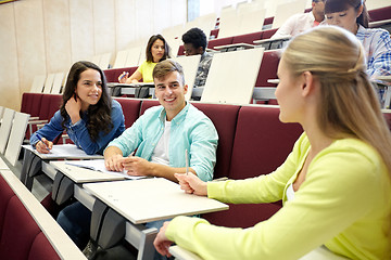 Image showing group of students with notebooks at lecture hall