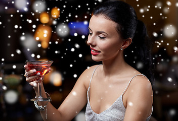 Image showing glamorous woman with cocktail at night club or bar