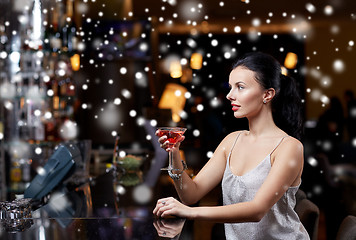 Image showing glamorous woman with cocktail at night club or bar