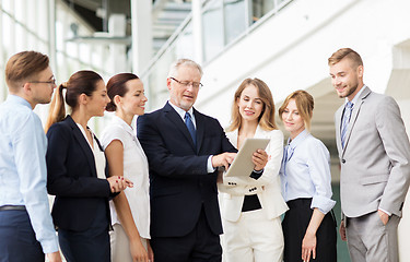 Image showing business people with tablet pc computer at office