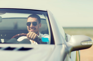 Image showing happy man driving cabriolet car outdoors