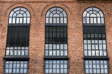 Image showing Large windows on brick wall