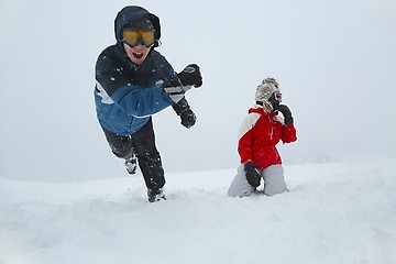 Image showing Skiers playing in the snow
