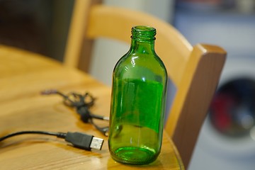 Image showing Empty bottle on table