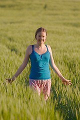 Image showing Woman walking on the field