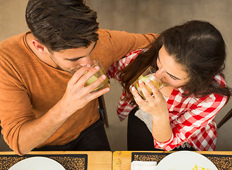 Image showing Young couple at the restaurant