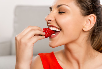 Image showing She loves strawberries