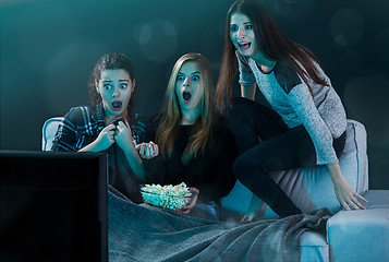 Image showing Scared teenage watching movies 