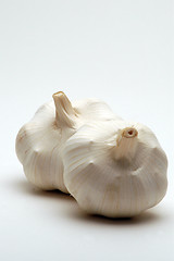 Image showing two garlic on white background