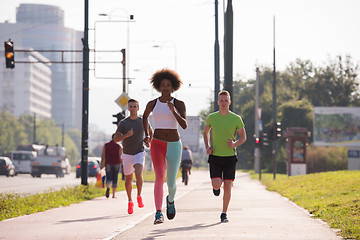 Image showing multiethnic group of people on the jogging