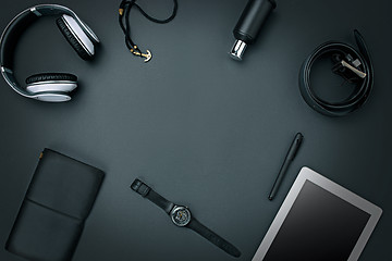 Image showing Workplace of business. Modern male accessories and laptop on black background
