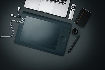 Image showing Workplace of business. Modern male accessories and laptop on black background