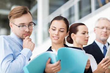 Image showing business team with folders meeting at office