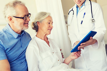 Image showing senior woman and doctor with tablet pc at hospital