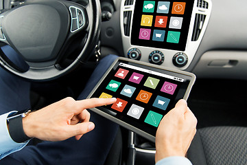 Image showing close up of man with tablet pc in car