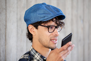 Image showing man recording voice or calling on smartphone