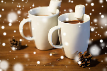 Image showing cups of hot chocolate with marshmallow on wood