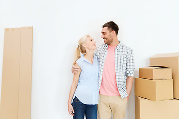 Image showing couple with cardboard boxes moving to new home