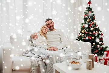 Image showing happy couple at home with christmas tree