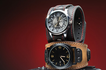 Image showing two men\'s watches with wide leather bracelet 