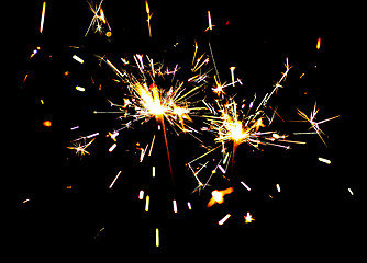 Image showing Two bright festive New Year Christmas sparklers