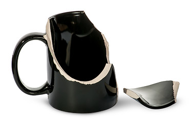 Image showing Broken black porcelain cup with one fragment