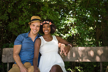 Image showing Young multiethnic couple having a bike ride in nature