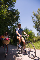 Image showing Young multiethnic couple having a bike ride in nature