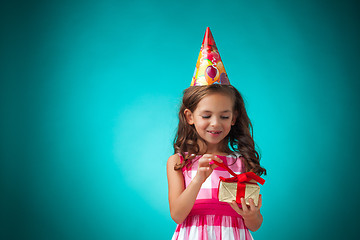 Image showing The cute cheerful little girl on blue background