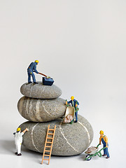 Image showing Pebbles stack and figurines of construction 