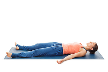 Image showing Women relaxes in yoga asana Savasana