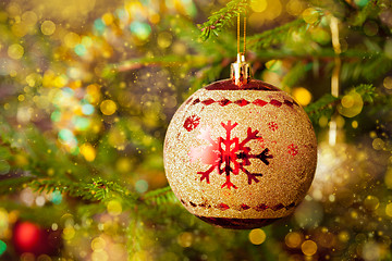 Image showing Decoration bauble on decorated Christmas tree background