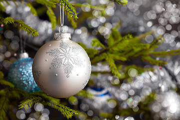 Image showing Decoration bauble on decorated Christmas tree background