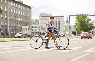 Image showing young man with fixed gear bicycle on crosswalk